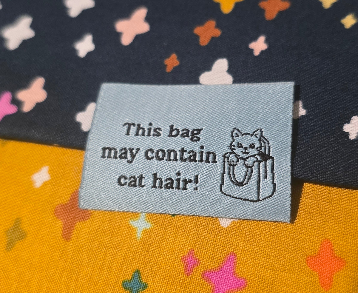 FUN labels MAY CONTAIN CAT HAIR